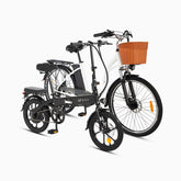 Two people enjoying a picnic near DYU A1F and C6 electric bikes with wicker baskets.